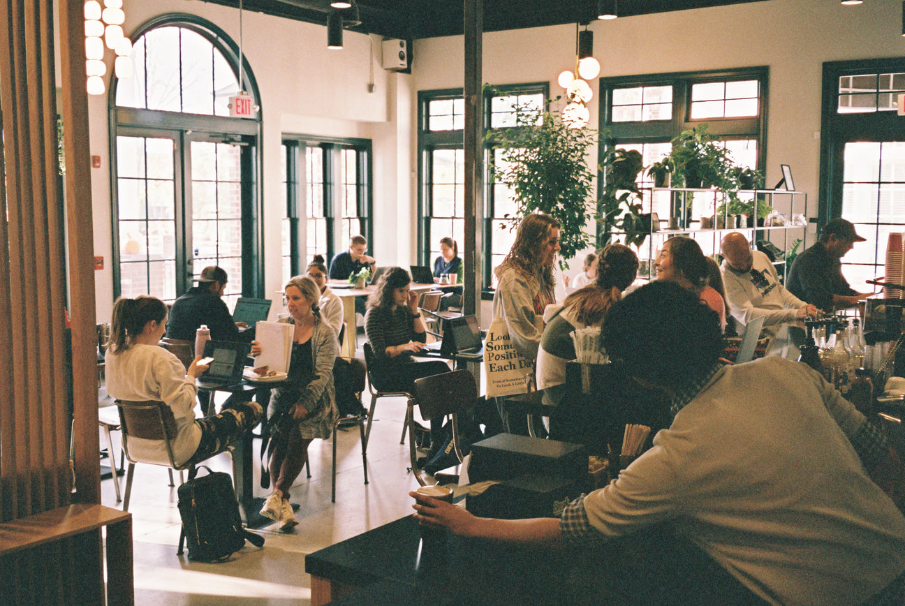 busy cafe with large windows and ambient lighting