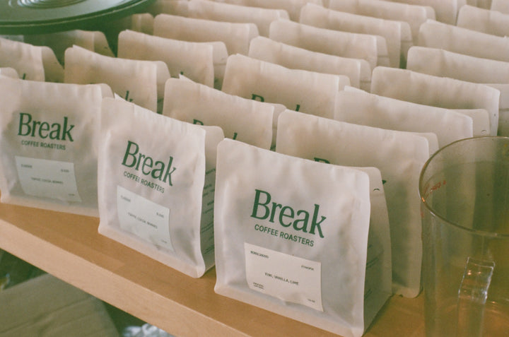 Rows of packaged coffee bags with the brand 'Break' displayed, indicating they are single origin coffees.