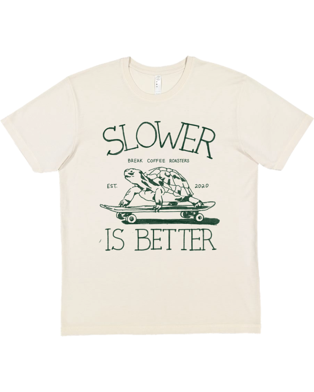 Beige t-shirt with a graphic of a turtle on a skateboard and text 'Slower is Better' on a white background.